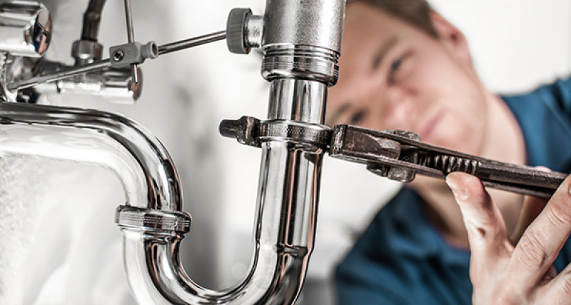 Man fixing plumbing